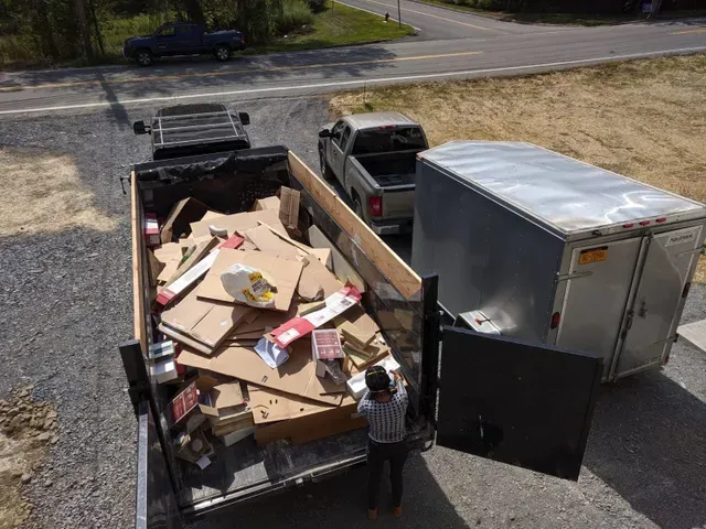 Junk removal truck loaded with items
